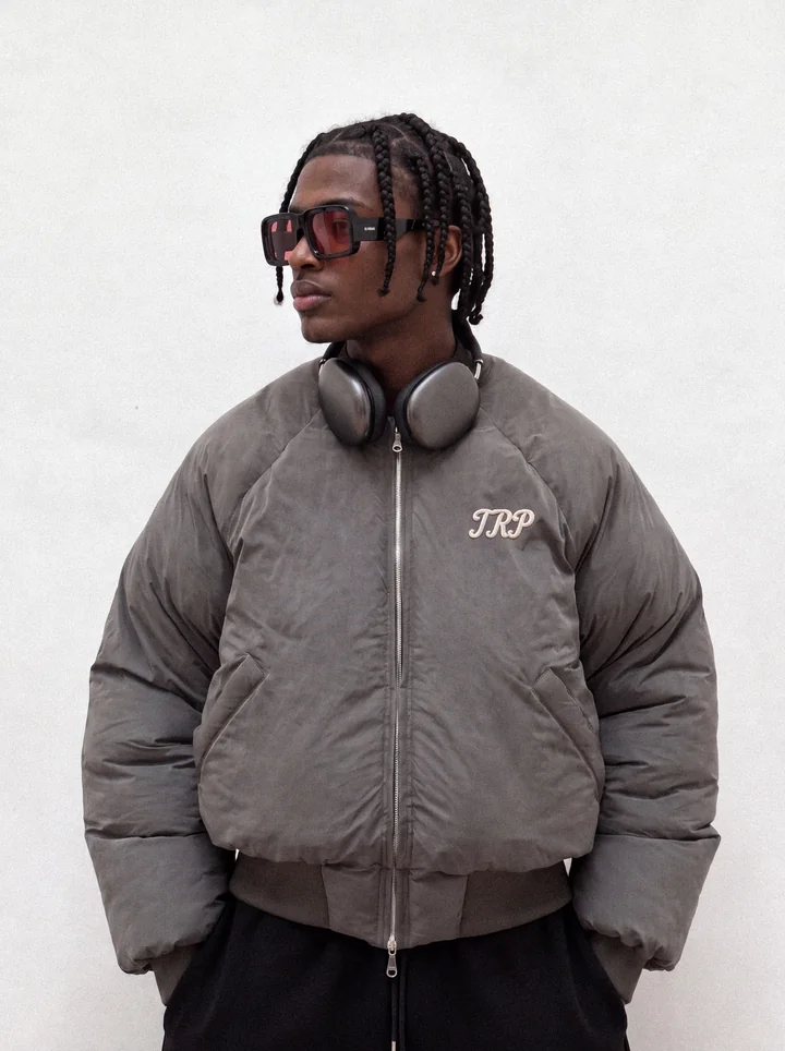 TRP campaign portrait in a grey jacket